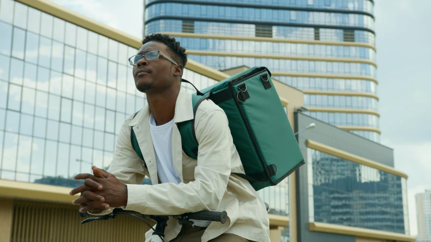 a man with a backpack holding a large suitcase