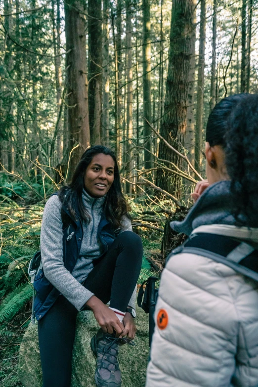 two women in the woods talking to each other