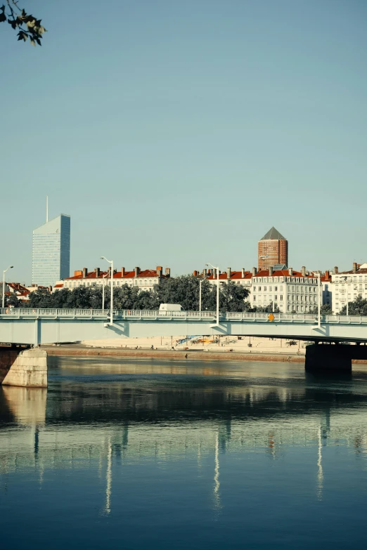 the bridge is high above the water in this city