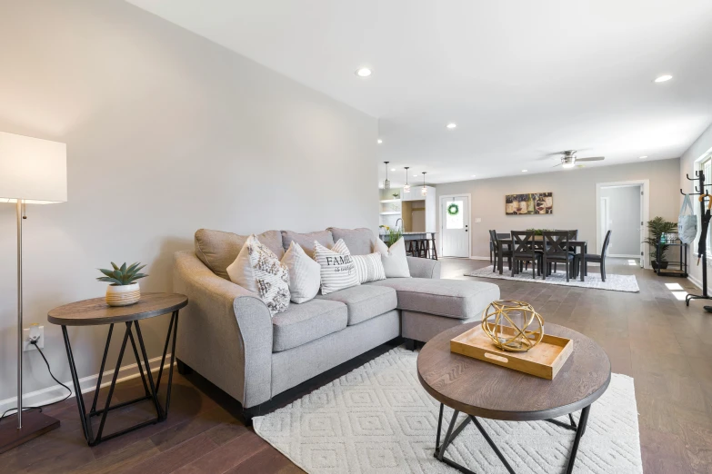 a living room with white walls and furniture