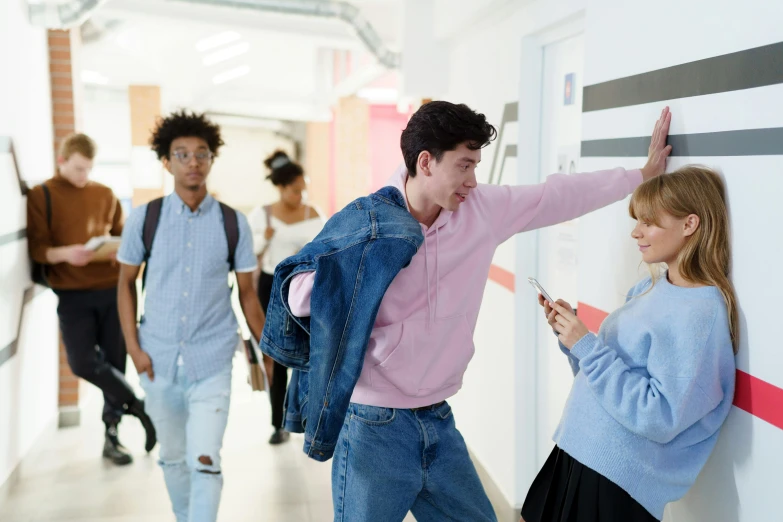 a group of people walking down a hallway together