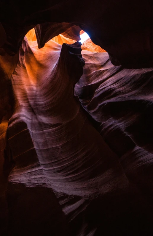 a person riding through the canyon into a light