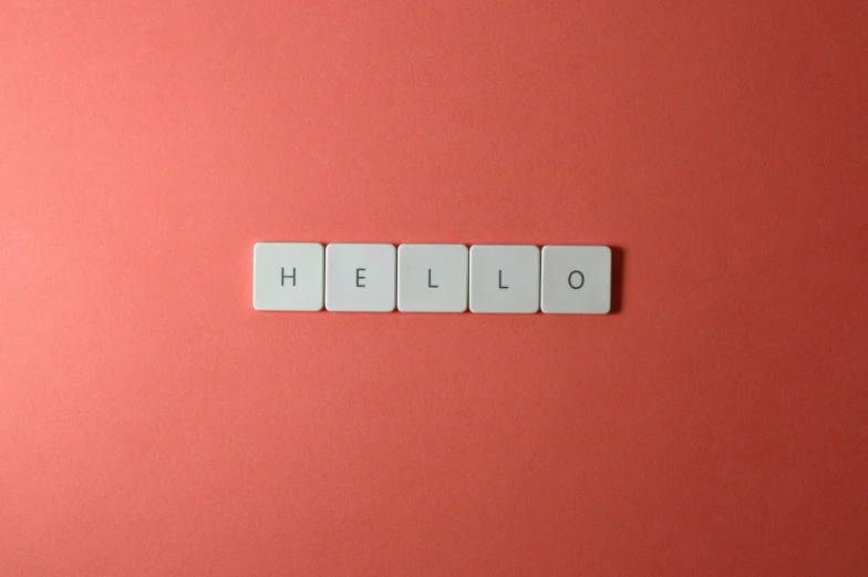 there is the word hello spelled with several white tile letters