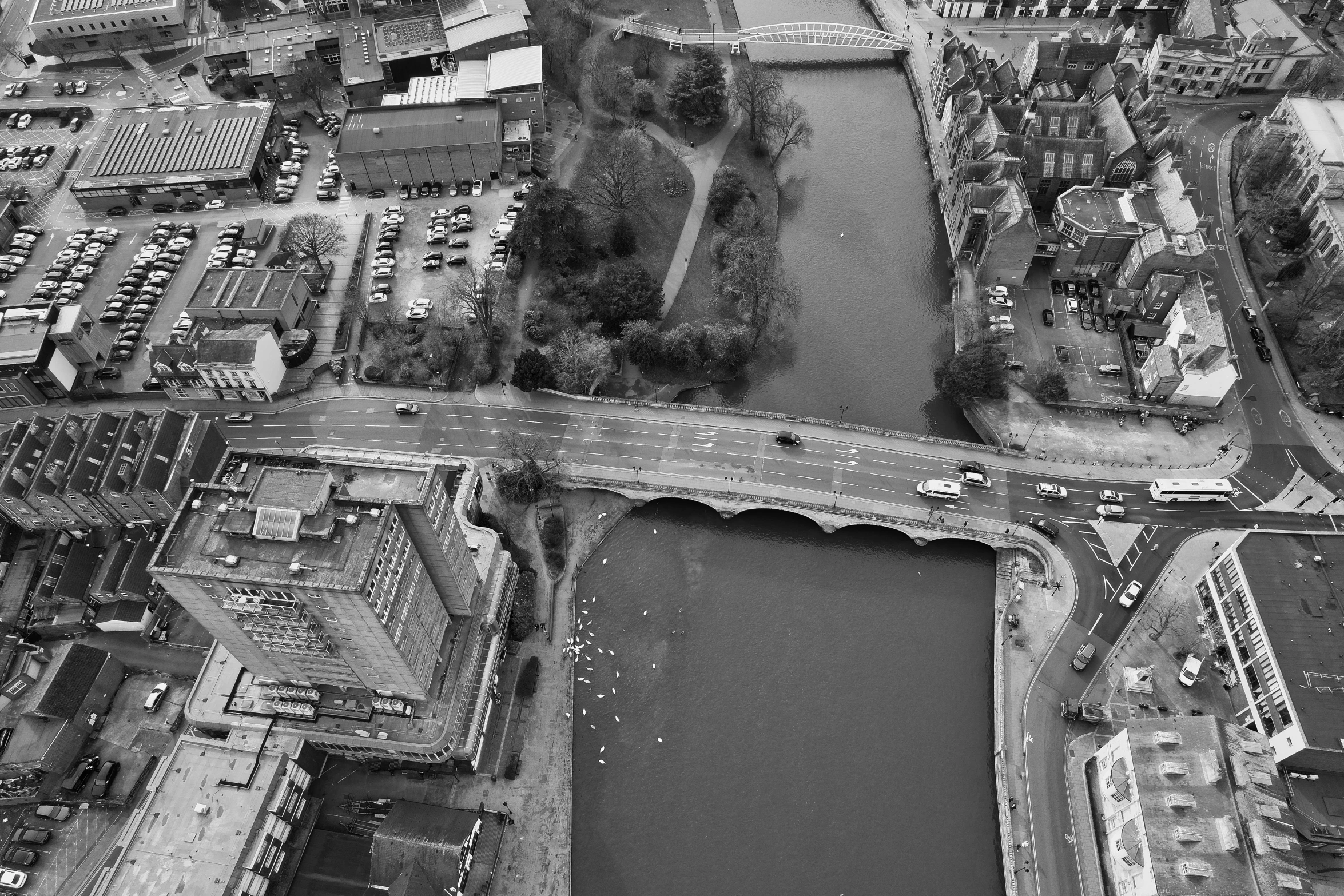 an aerial view of a busy city with buildings and bridges