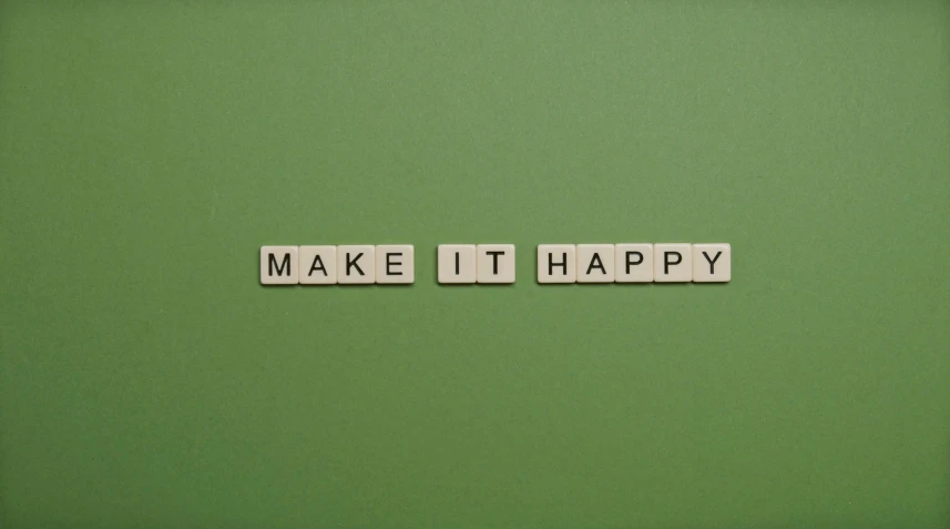 word made out of scrabble letters that spell make it happy
