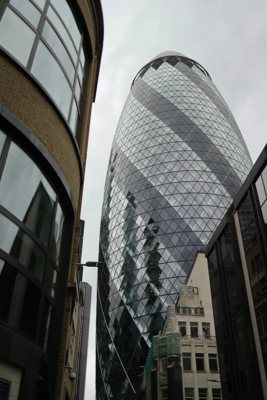 modern glass buildings are viewed from the street