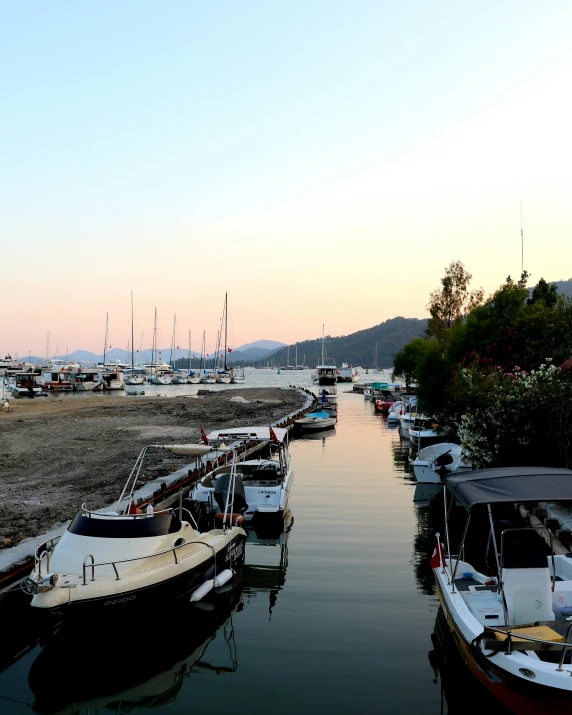 a large marina filled with boats and docked in the water