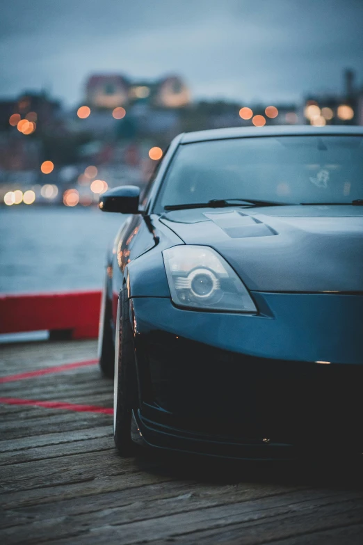 a car parked on the side of a wooden dock