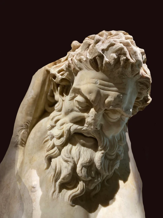 an ancient statue with beard and hair