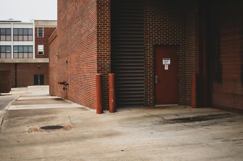 two parking meters sitting next to a building