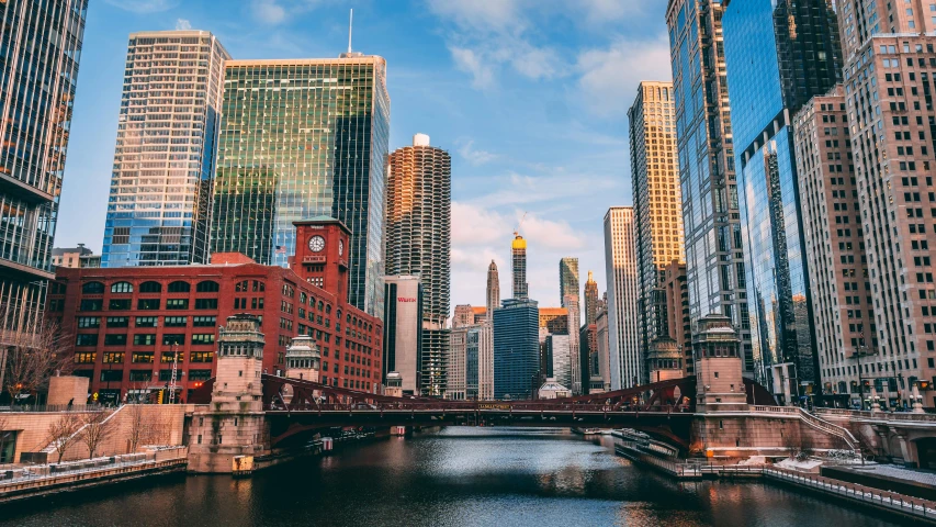 city with tall buildings on the bank of water