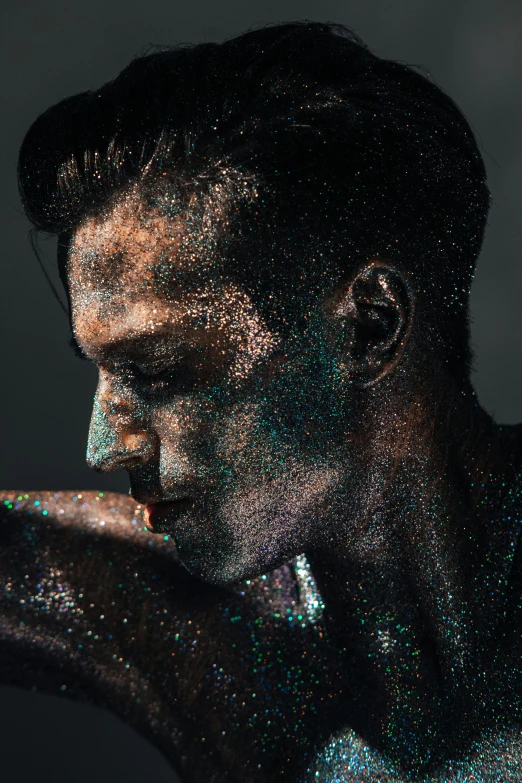 a man with sprinkles on his face and arms