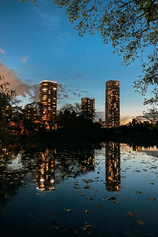 an image of some buildings in the evening