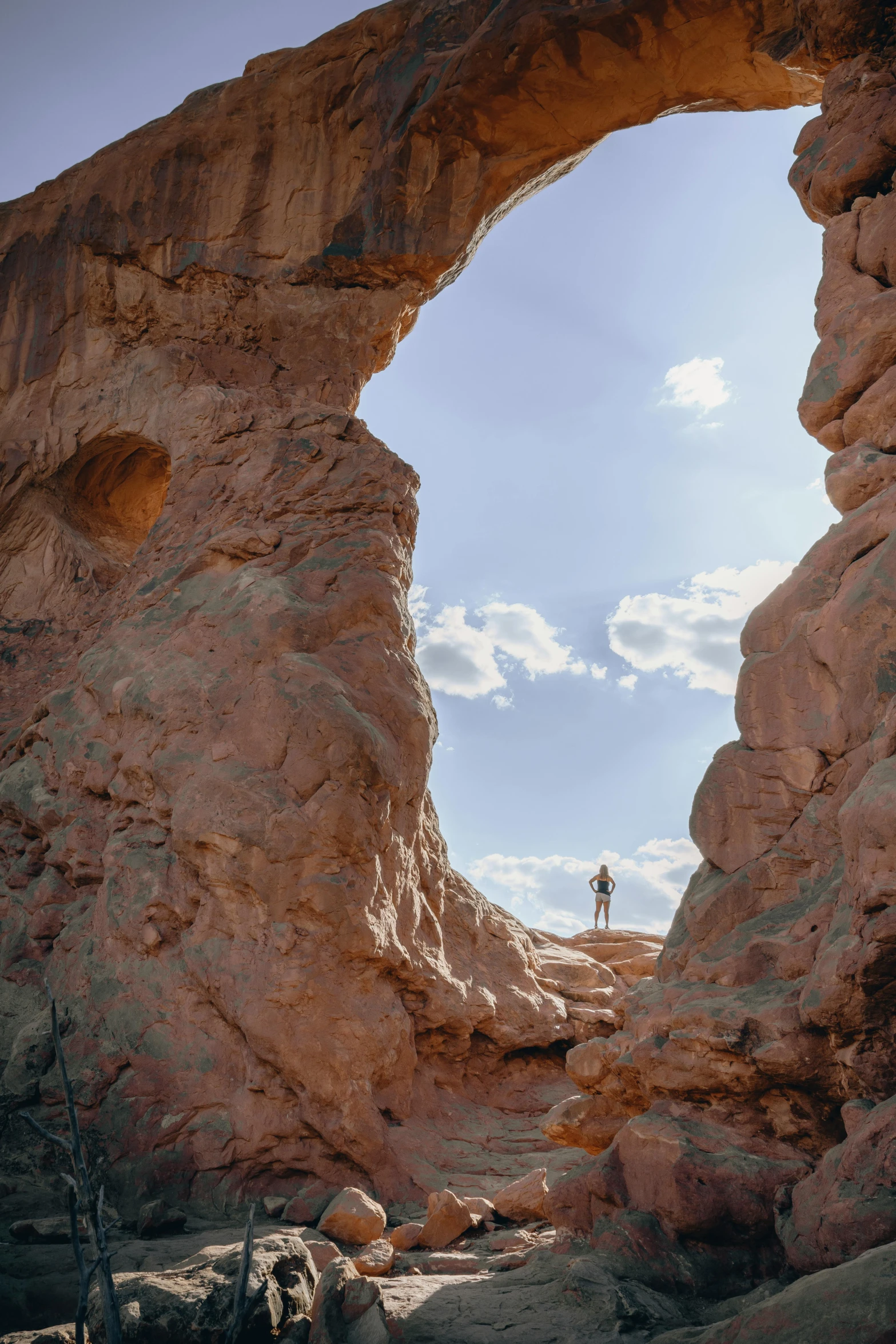 a person that is standing in the middle of a desert