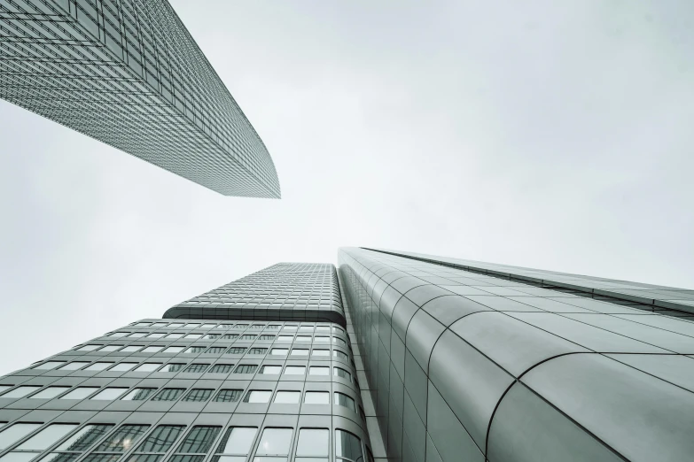 two tall building side by side with some windows