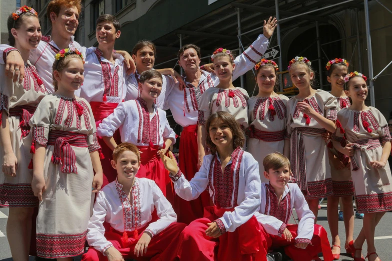 a group of people in colorful clothes posing for a picture