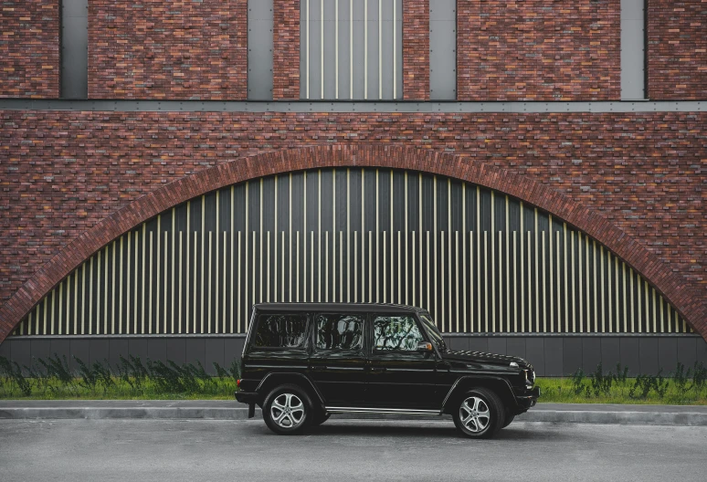 the land rover has a large grilled window on its side