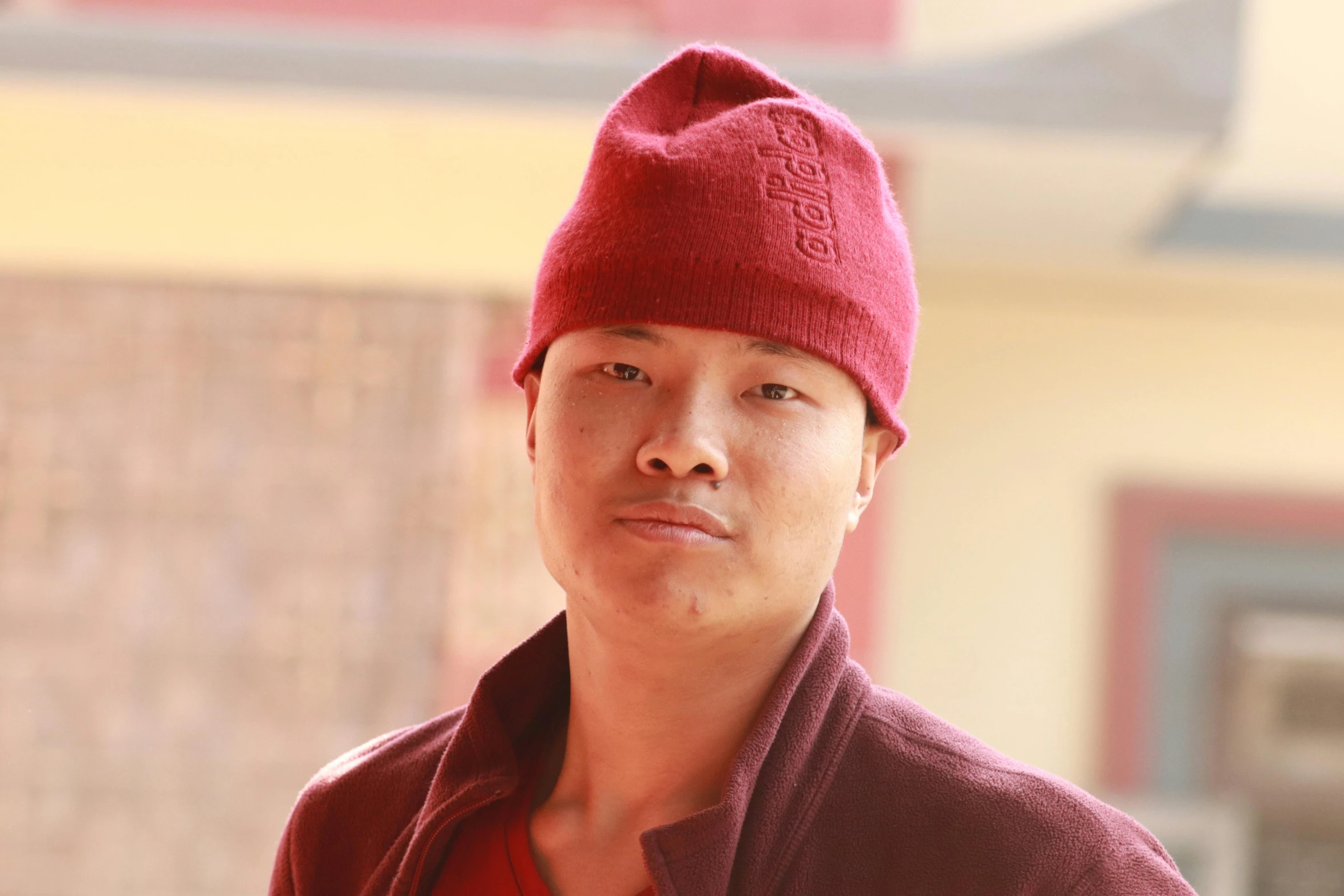 a man with a red sweater and red hat