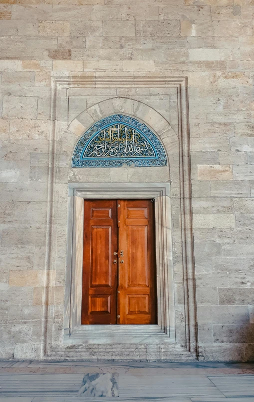 an old building has a decorative door and window