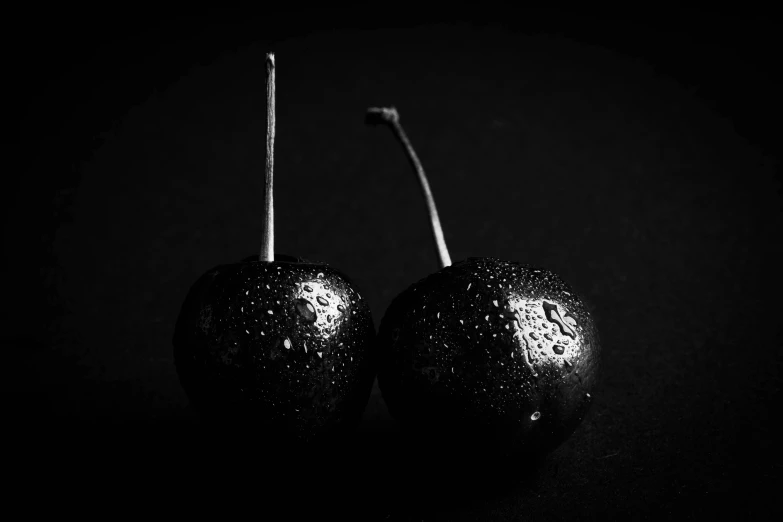 two fruits that are sitting on a table