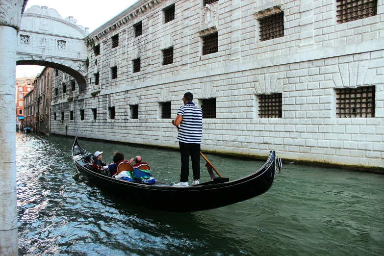 a boat of people in it is sailing on the water