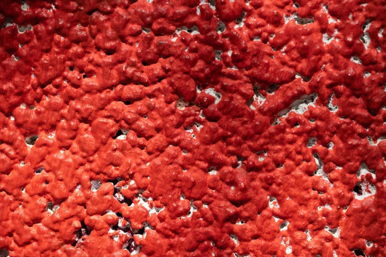 a red carpet covered in small holes