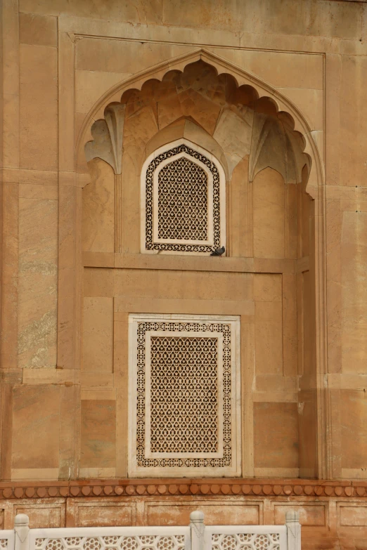 intricate architectural window and door of a building