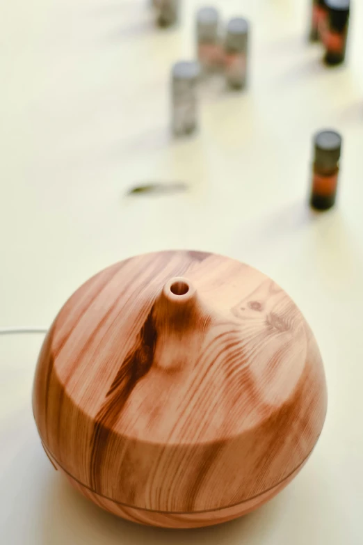 a close up of a wooden object on a table