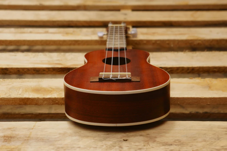 a guitar laying on the floor inside a house