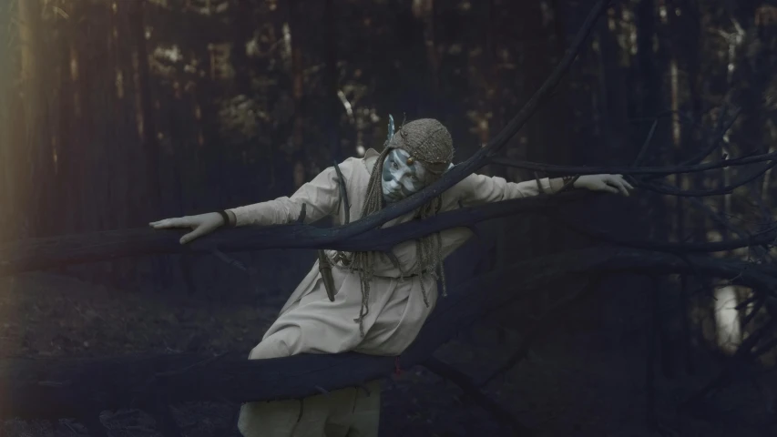 a masked person is reaching into the woods