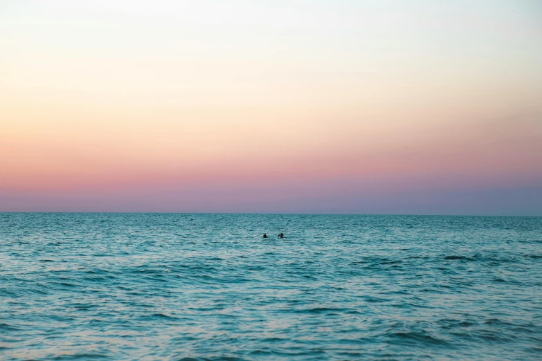 the person is riding a board in the ocean