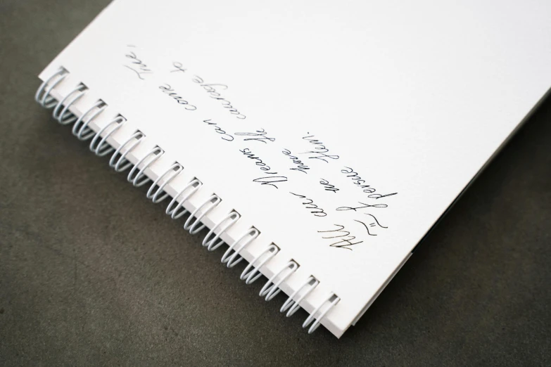 a notepad with some writing on it