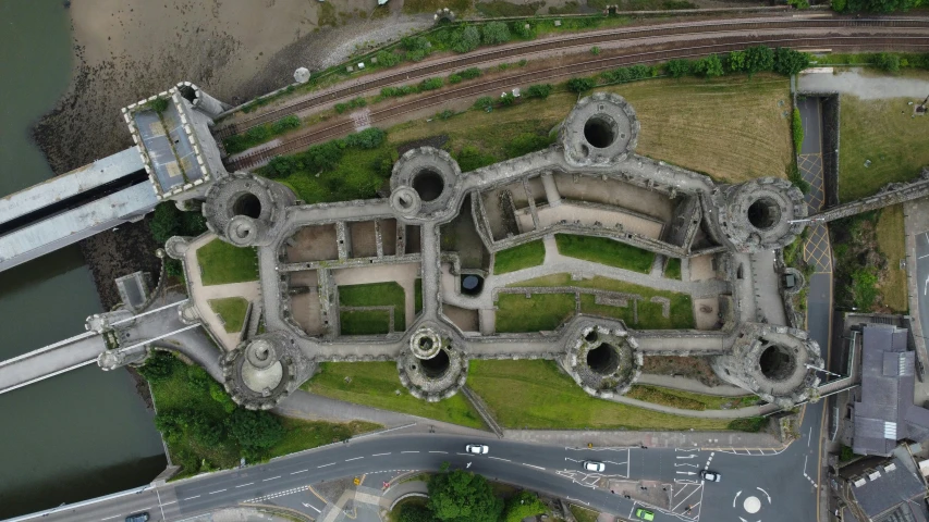 an aerial view of the ground with some very interesting structures