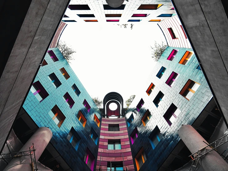 looking up from below a multicolored building