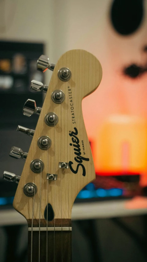 an electric guitar is lying against the background