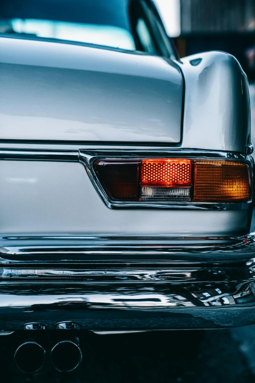 an old car rear end view in motion