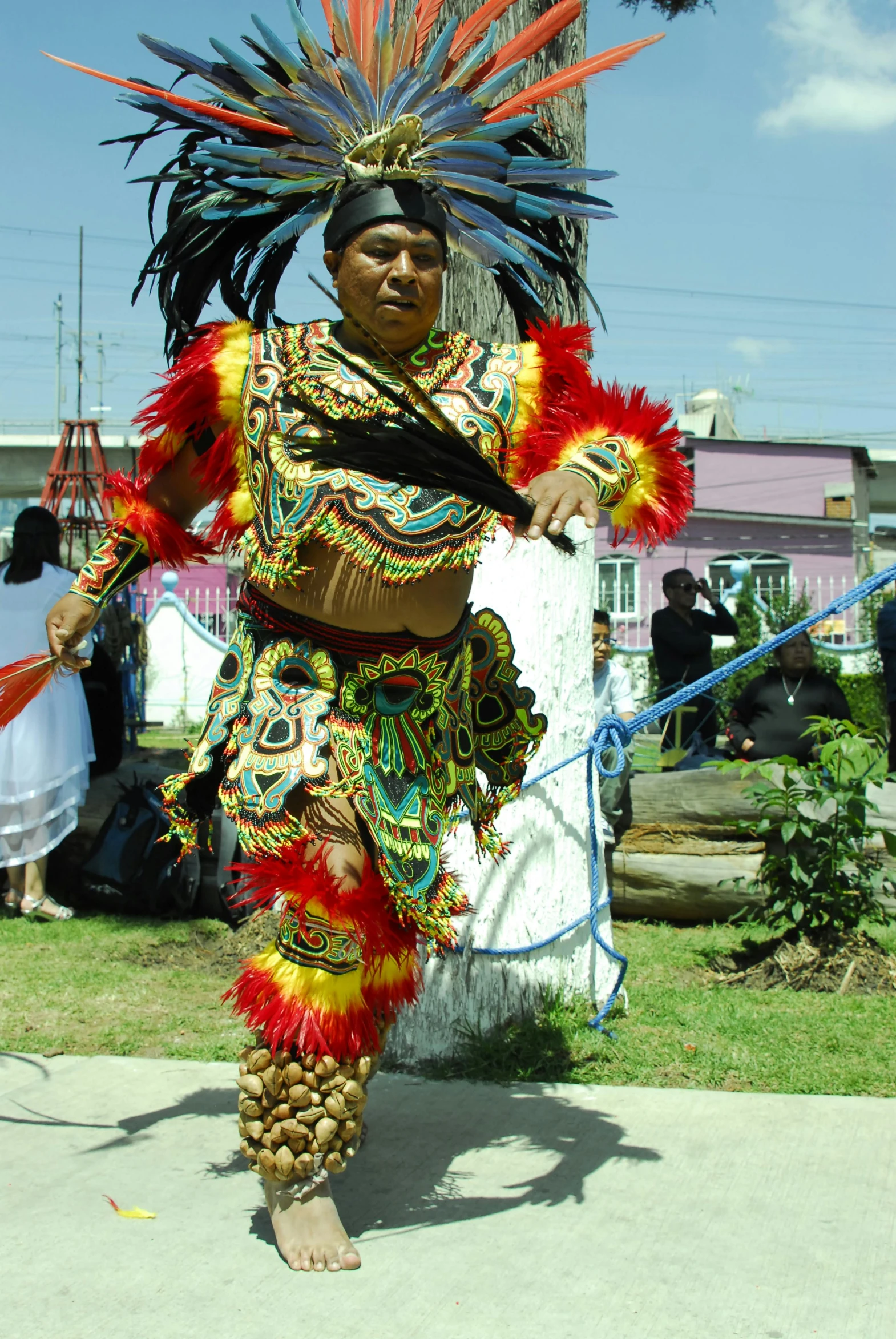 woman in a brightly colored costume is walking