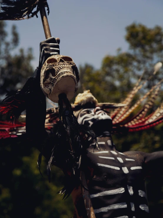 two puppets are hanging from a pole together