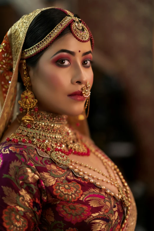 indian model wearing beautiful bridal and necklaces at an event
