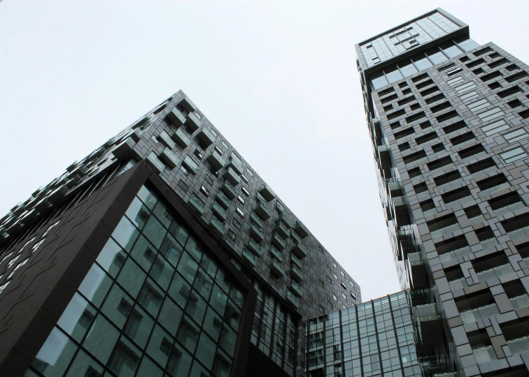 two building that are sitting in the sky