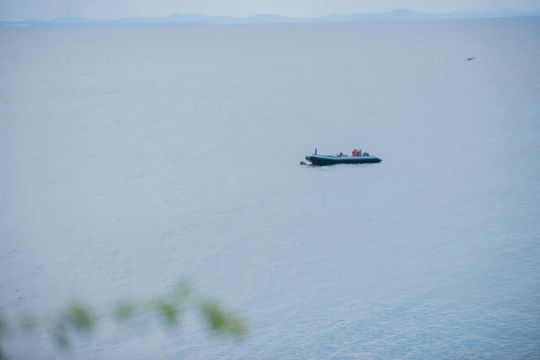 a boat that is floating on some water