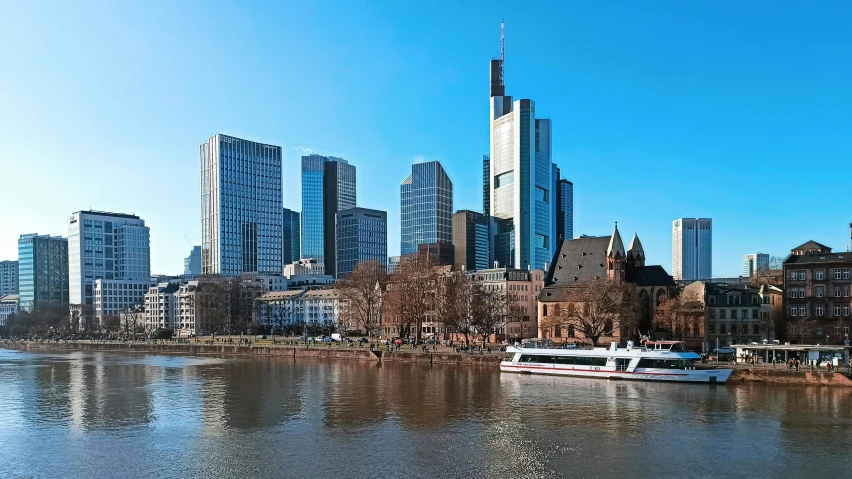 a boat travels down the river next to buildings