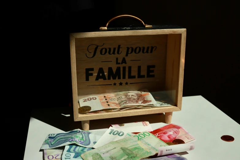 a wooden box with a picture of a family on top of it