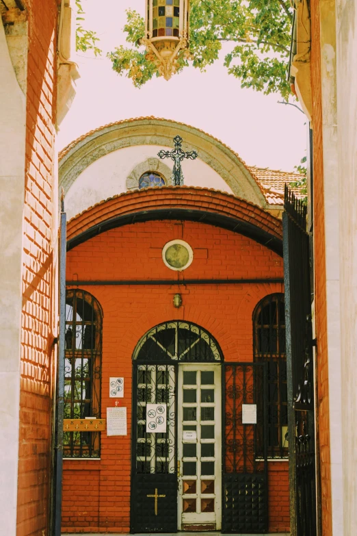 a door and doorway leading into the outside of a red brick building