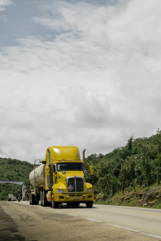 a cement truck on the road in the middle of nowhere