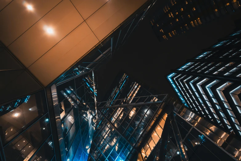 a tall building with lots of windows at night