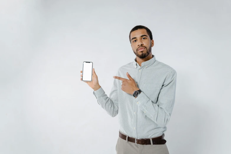 a man is holding up his fingers to show it