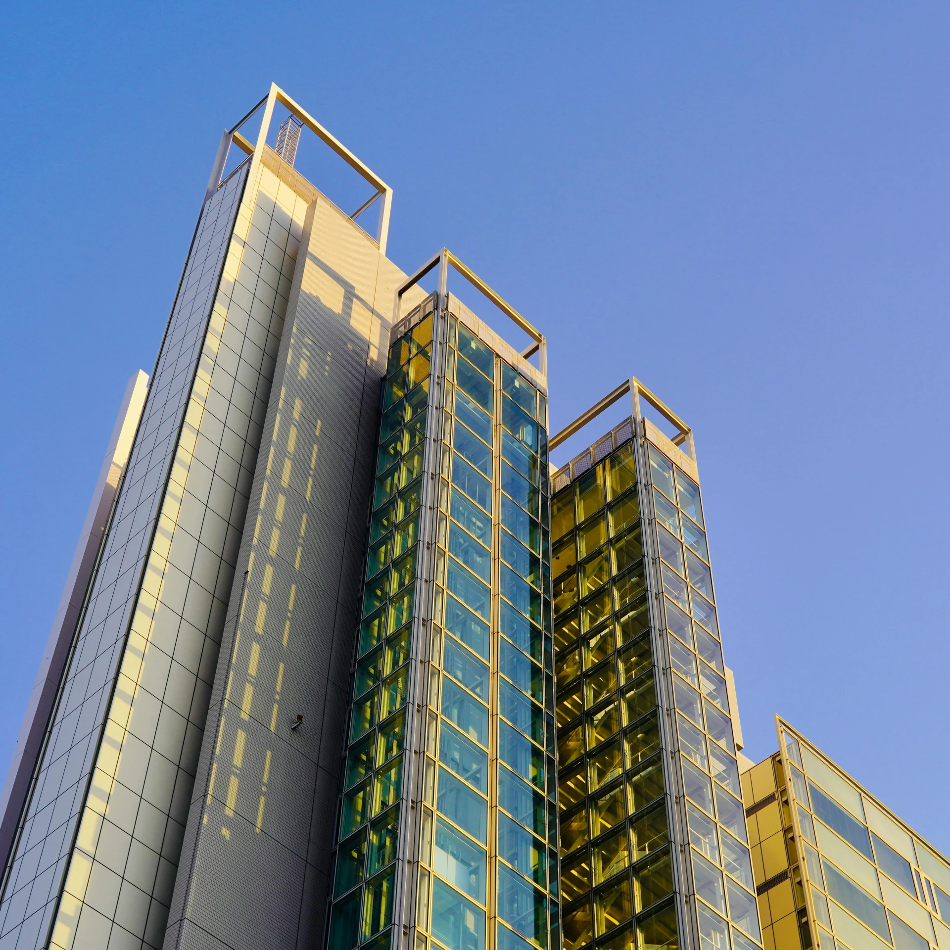 the tops of some buildings on a clear day