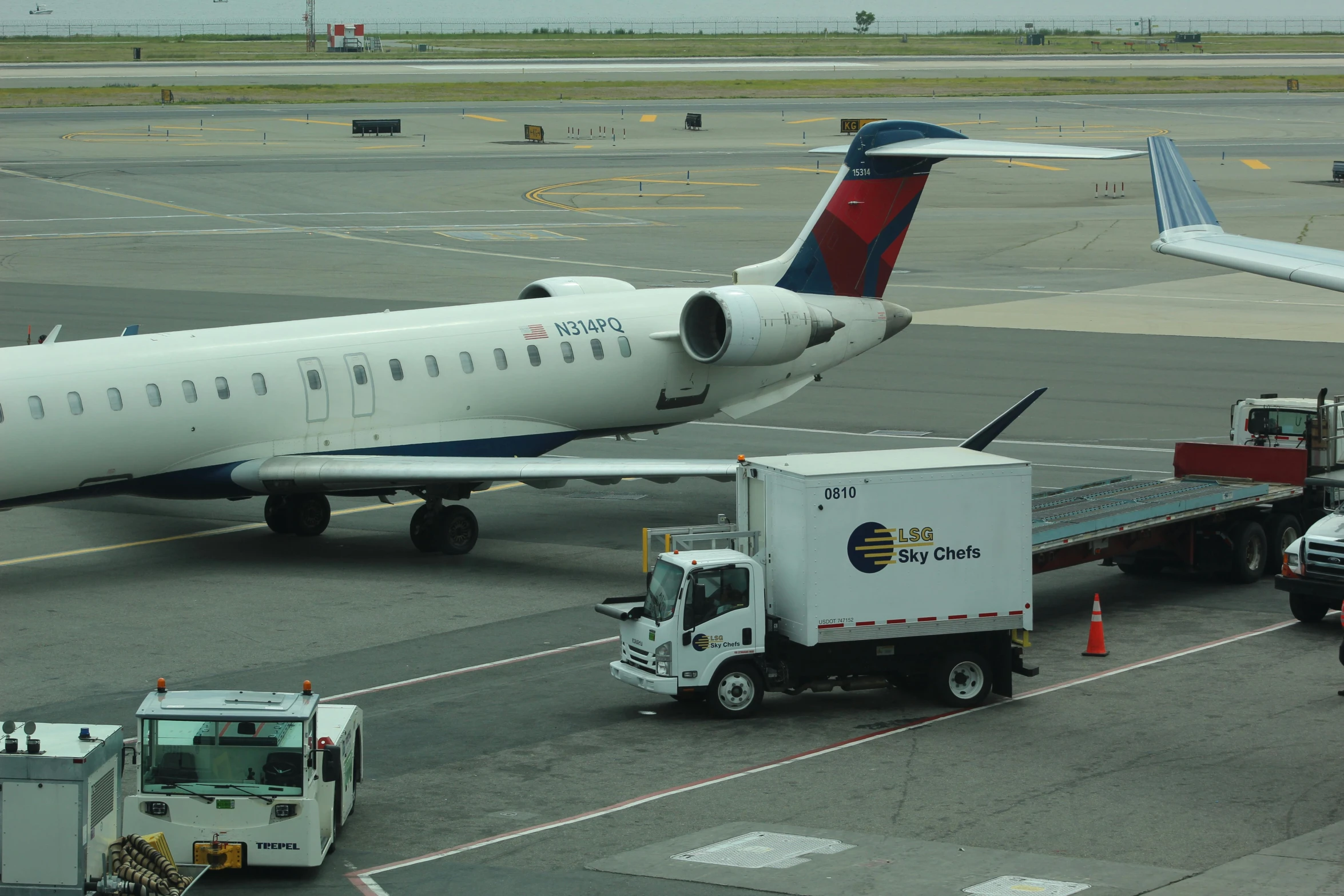 a large plane sitting on top of an airport tarmac