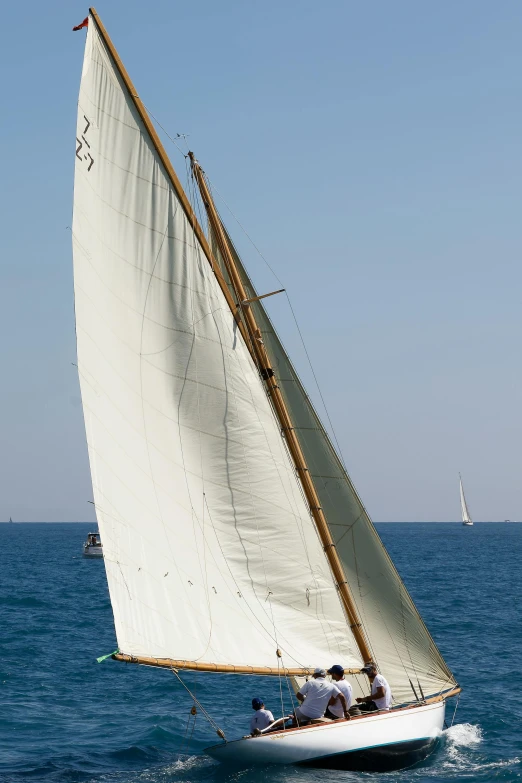 a small white boat in the open ocean